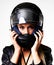 Even a daredevil needs protection. Closeup of a stunning young woman wearing a motorcycle helmet.