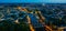 Evening aerial view of Laval with buildings, river Mayenne and old bridge