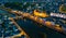 Evening aerial view of Laval with buildings, river Mayenne and old bridge