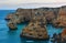 Evening Atlantic rocky coastline near Lagoa, in Algarve, Portugal.