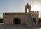 Evening backlight silhouette of an Old mosque on sunset, Qatar. Middle East. Persian Gulf.