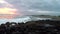 Evening beach with vacationers and village