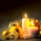 Evening Christmas Decorations background with candles, baubles and ribbons