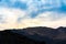 Evening Clouds Sparkling Down over Mountain