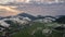 Evening colors over snowy rural landscape in early spring countryside. Aerial Time lapse hyperlapse