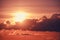 Evening cumulus clouds with the setting orange sun