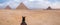 Evening desert and Giza pyramids with a horse on foreground, no tourists, near Cairo, Egypt.