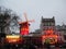 An evening display of lights from the Moulin Rouge in Paris