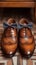 Evening elegance mans brown leather shoes with a bow tie