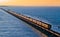 Evening golden sunlight reflects on the sides of Chennai bound Boat Mail express over Pamban bridge