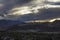 Evening heavy sunset sky over the city in a mountain valley of the Himalayas