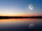 Evening lake under the Moon