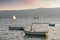 Evening landscape with sailboats and fishing boats on the water. Montenegro, Bay of Kotor. Travel and vacation concept