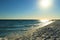 Evening landscape, sunset on the beach, dusk, ocean, dim sun and blue sky