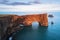 Evening landscape with views of the rocky cape and ocean in Iceland