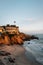 Evening light on cliffs at Wood`s Cove, in Laguna Beach, Orange County, California