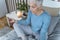 Evening Meditation for a Better Sleep. Senior Woman Meditating in Lotus Position at Home