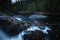 Evening mood in boreal forests of Norway. Waterfalls on river Homla