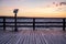 Evening mood on the pier on the Baltic Sea with a telescope