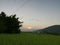 An evening over sky view with paddy crops below and A burapahar mountain