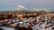 Evening panorama of the city of Togliatti overlooking residential buildings and smoking pipes of chemical plants.