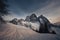 Evening panorama of the majestic north face of Mount Pelmo in winter conditions