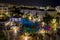 Evening photo overlooking the colorful lighted hotels and a swimming pool in Costa Adeje, Tenerife, Spain