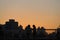 Evening picture. Silhouettes of people walking along the seafront 26 Dec 2020