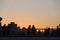 Evening picture. Silhouettes of people walking along the seafront 26 Dec 2020