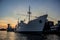 Evening port in Kaliningrad Cargo ship in the harbor on sunset background