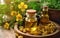Evening primrose oil in bottle, pills and flowers on wooden table