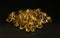 Evening primrose oil capsules on a black surface, with a shallow depth of field