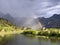 Evening rainbow after the spring downpour over meadows and pastures in the Sihltal valley and by the artifical Lake Sihlsee