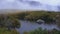 Evening scenery at base camp during trek to Pic Boby Madagascar highest accessible peak, small river flowing in foreground,