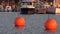 Evening in sea harbor with a ships and orange orange buoys