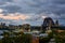 Evening sets over the Sydney Harbour Bridge and lively waterfront in Australia`s beautiful harbor city