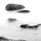 Evening shore sea water and stones on a beach