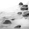 Evening shore sea water and stones on a beach