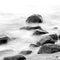 Evening shore sea water and stones on a beach