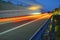 Evening shot of trucks doing transportation and logistics on a highway. Highway traffic - motion blurred truck on a