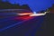 Evening shot of trucks doing transportation and logistics on a highway. Highway traffic - motion blurred truck on a