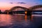 Evening silhouette skyline landscape of the gothic Cologne Cathedra, Hohenzollern railway and pedestrian bridge, the old town and