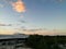 The evening sky as the sun sets Above the factory roof