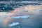 Evening sky clouds reflecting in water with ice floes in Antarctica