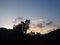 Evening sky dark mountain range trees clouds colourful