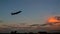 Evening sky and the plane gaining altitude