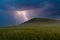 Evening stormy landscape over a summer field