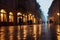 Evening streets of the old town with bright orange lanterns reflecting off the wet cobblestones in the rain with fog and