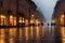 Evening streets of the old town with bright orange lanterns reflecting off the wet cobblestones in the rain with fog and