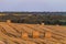 Evening summer field with straw bales